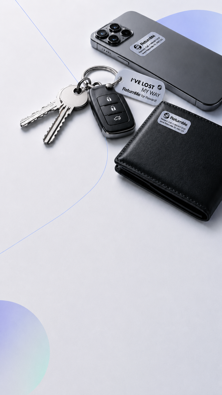 A phone, a car key fob with keys and a leather wallet arranged on a pale studio surface.